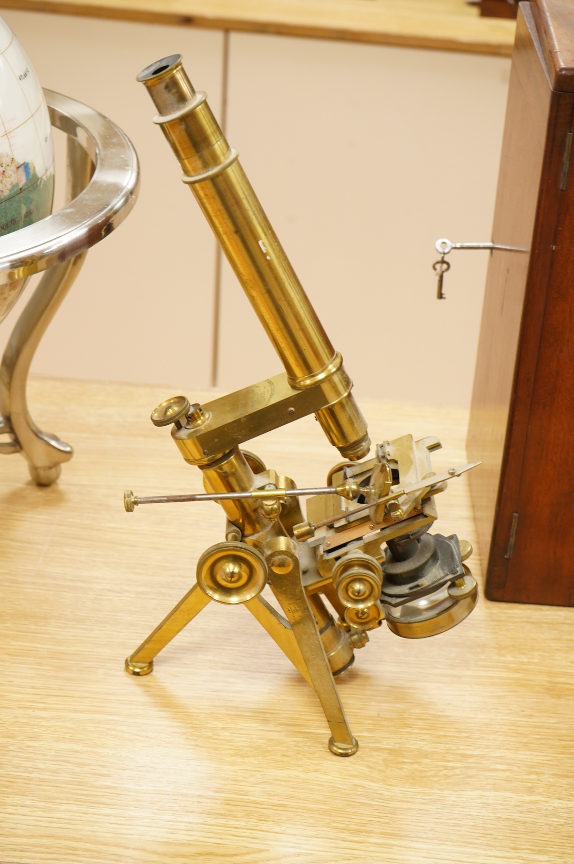 A fine mid 19th century brass compound monocular microscope, by Powell and Lealand, 170, Euston Road, London, dated 1869, mahogany cased, together with a mahogany cased accessory box, containing - 7 objectives, 4 Leiberk